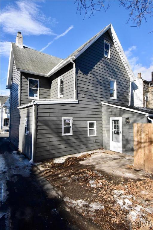 rear view of property featuring a patio