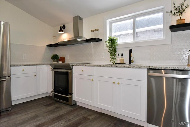 kitchen with sink, island range hood, white cabinets, and appliances with stainless steel finishes