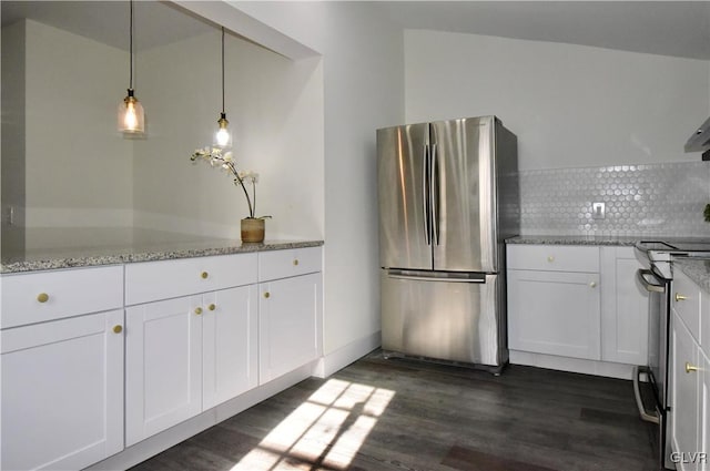 kitchen featuring white cabinetry, stainless steel appliances, and light stone countertops