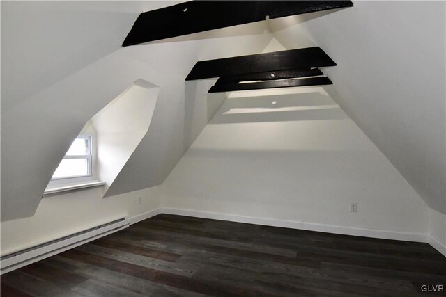 interior details with wood-type flooring and a baseboard heating unit