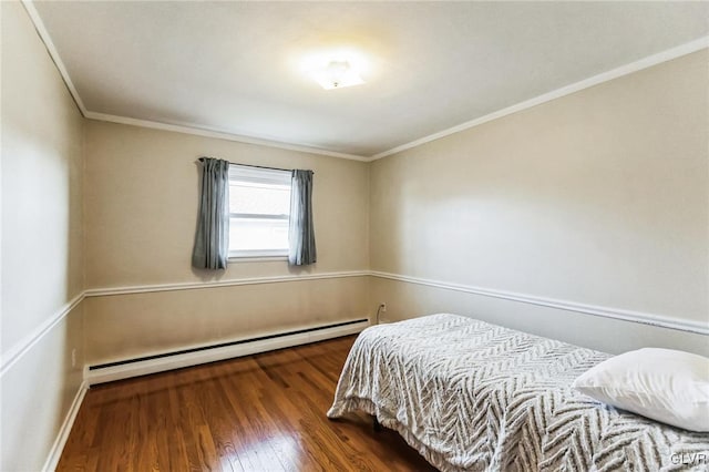 bedroom with baseboard heating, dark hardwood / wood-style flooring, and crown molding