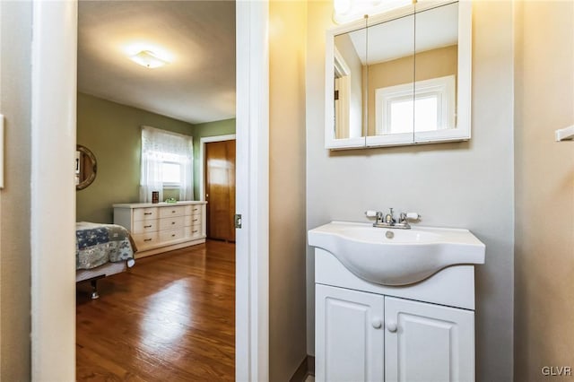 bathroom with vanity and hardwood / wood-style flooring