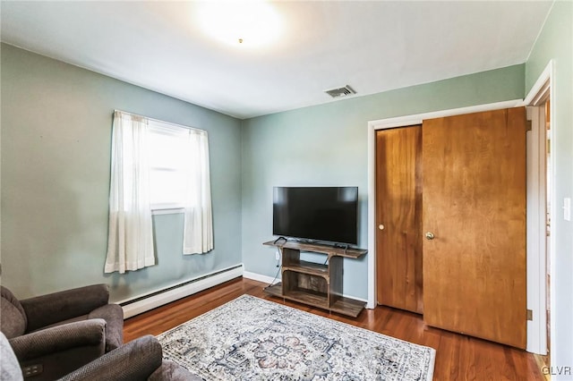 living room featuring hardwood / wood-style flooring and a baseboard radiator