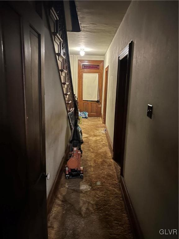 corridor with light colored carpet