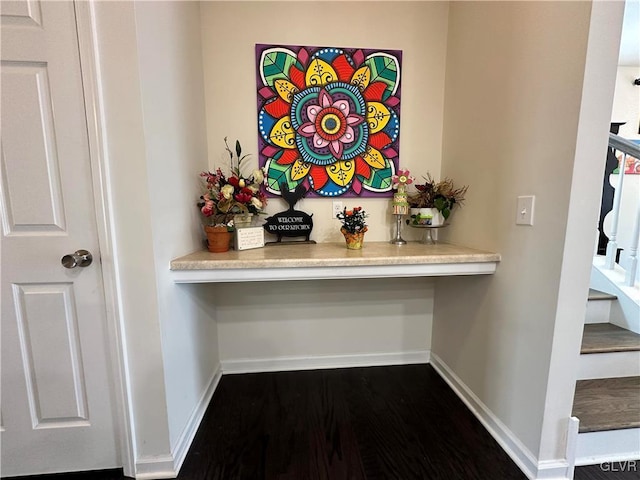 hall with dark hardwood / wood-style floors