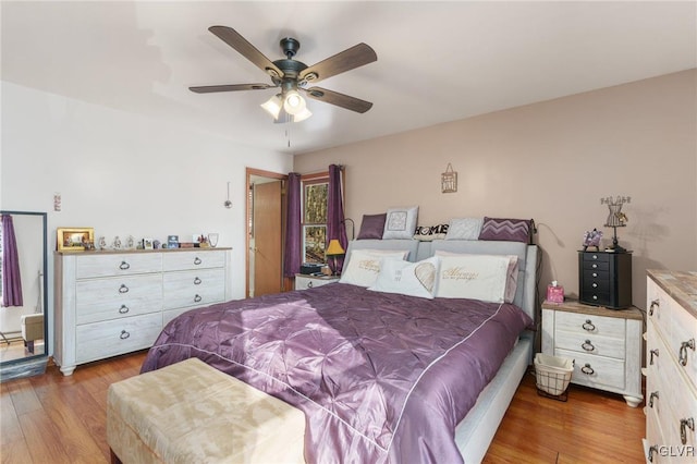 bedroom featuring hardwood / wood-style flooring and ceiling fan