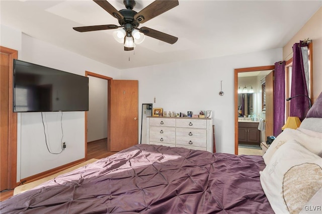 bedroom with ceiling fan and ensuite bathroom