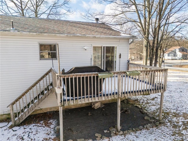 view of snow covered deck