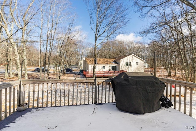 snow covered deck with area for grilling