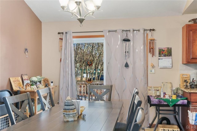 dining area featuring a notable chandelier