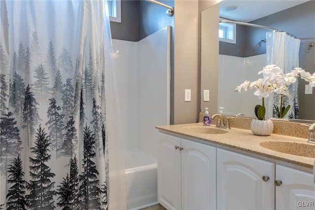 bathroom with vanity and shower / tub combo