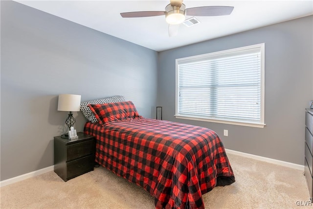 bedroom with light carpet and ceiling fan