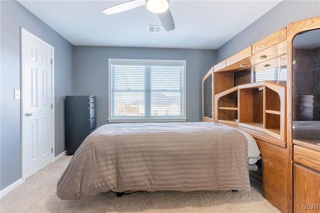 bedroom with light colored carpet and ceiling fan