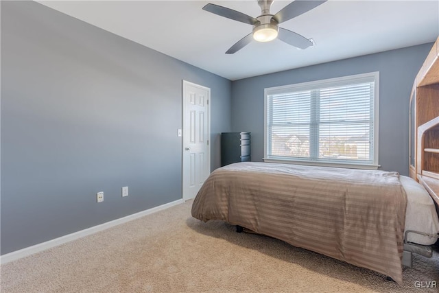 bedroom with light colored carpet and ceiling fan