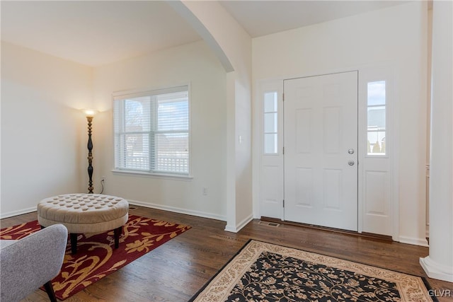 foyer entrance with dark hardwood / wood-style flooring