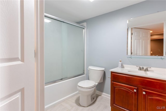 full bathroom featuring enclosed tub / shower combo, vanity, toilet, and tile patterned flooring