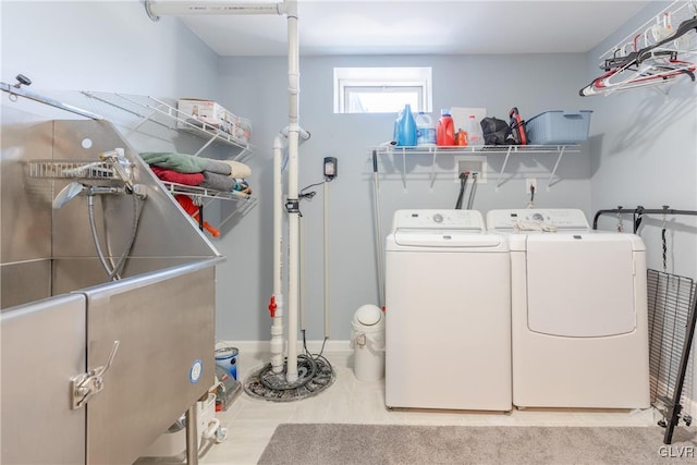 clothes washing area featuring separate washer and dryer