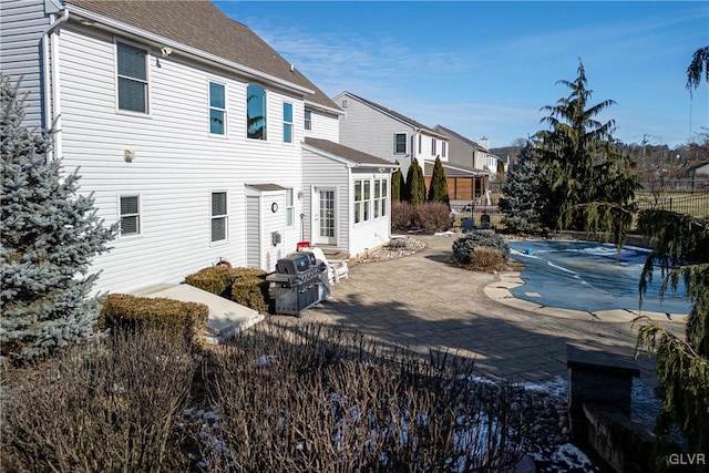 back of property featuring a patio