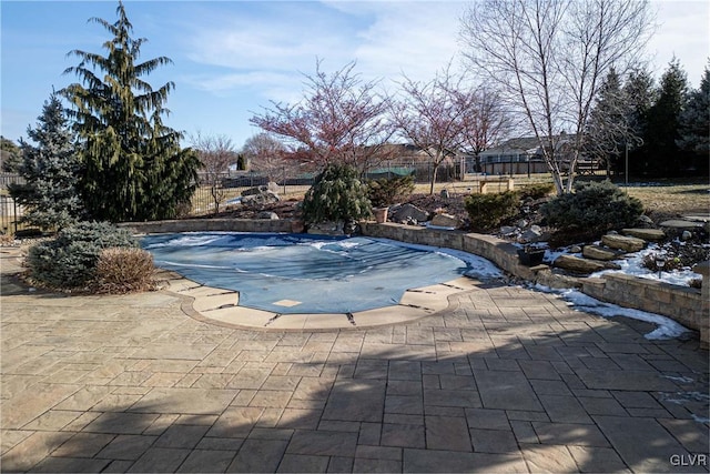 view of swimming pool featuring a patio area