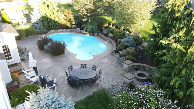 view of pool featuring a patio area and an outdoor fire pit