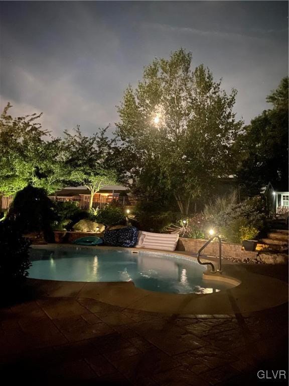 view of pool featuring a patio area