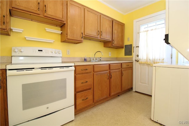 kitchen featuring washer / clothes dryer, crown molding, sink, and electric range