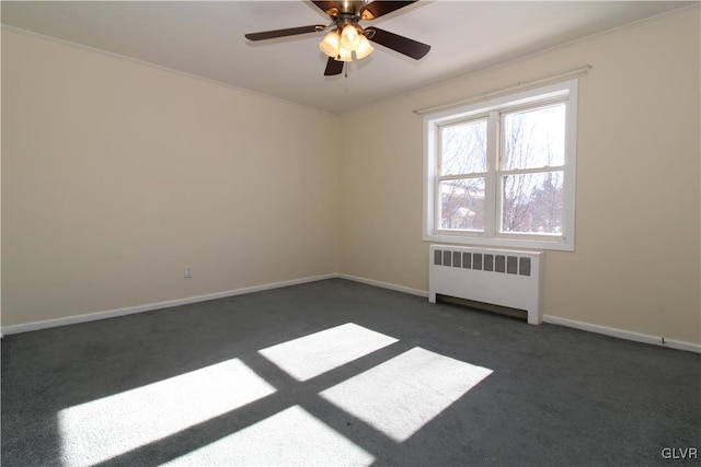 carpeted empty room with radiator heating unit and ceiling fan