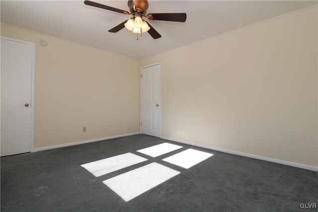 empty room with dark carpet and ceiling fan