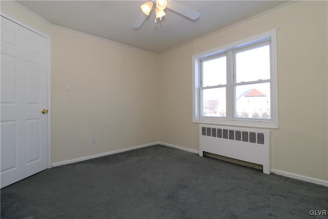 carpeted empty room featuring crown molding, radiator heating unit, and ceiling fan