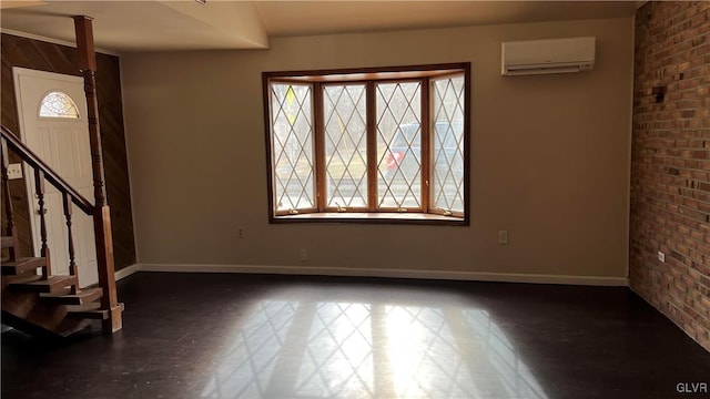 foyer with brick wall and an AC wall unit