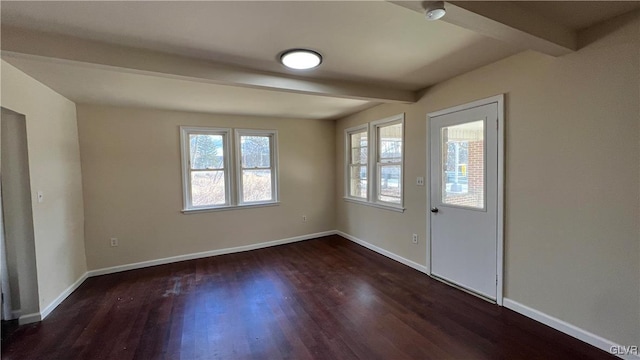 foyer featuring beamed ceiling and dark hardwood / wood-style flooring