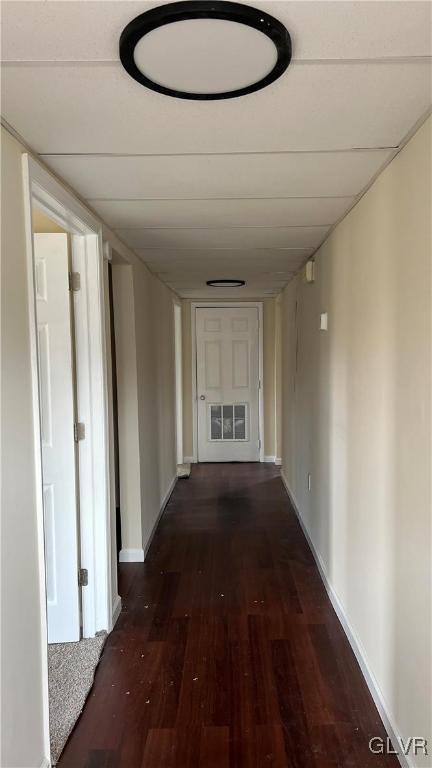 corridor featuring dark hardwood / wood-style flooring