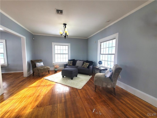 unfurnished living room with ornamental molding and wood-type flooring