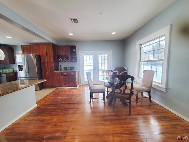 dining area with dark hardwood / wood-style flooring