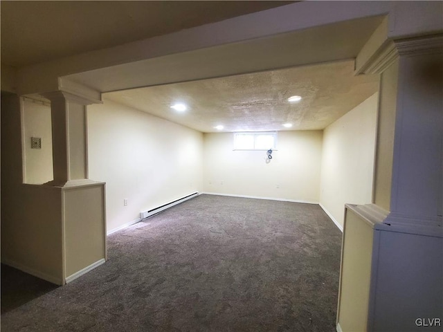 basement featuring baseboard heating and dark carpet