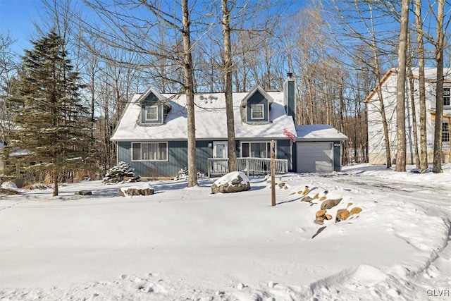 cape cod-style house with a porch and a garage