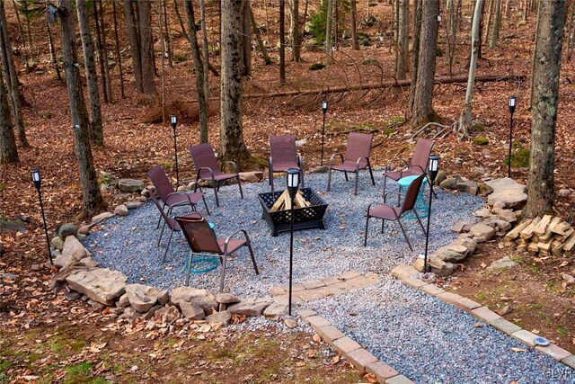 view of patio / terrace with an outdoor fire pit