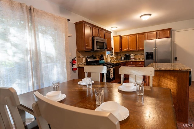 dining space with sink