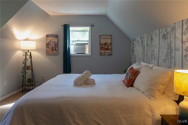 bedroom featuring lofted ceiling and carpet floors