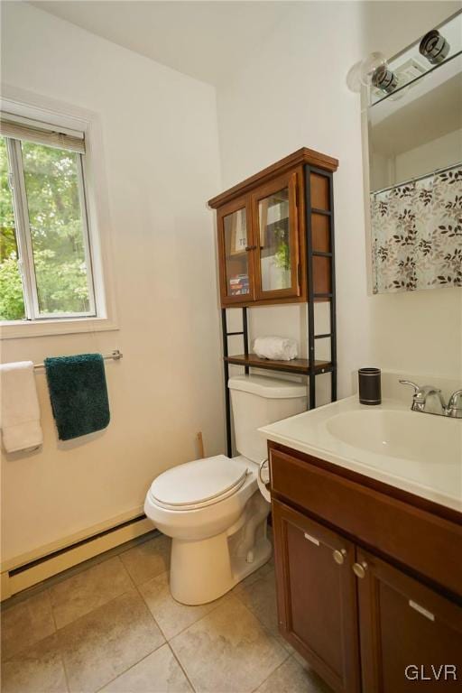 bathroom featuring vanity, tile patterned floors, toilet, and baseboard heating