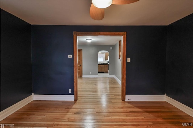 unfurnished room with ceiling fan and light hardwood / wood-style floors