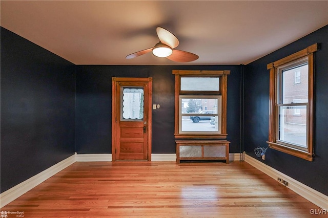 foyer featuring ceiling fan and light hardwood / wood-style floors