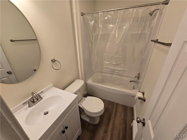 full bathroom with shower / tub combo with curtain, hardwood / wood-style floors, vanity, and toilet