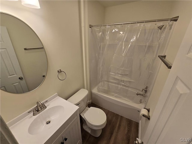 full bathroom featuring hardwood / wood-style flooring, vanity, shower / tub combo, and toilet