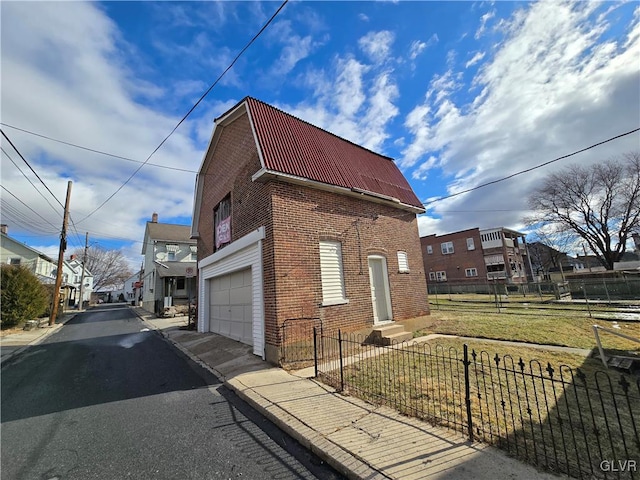 view of side of home with a yard