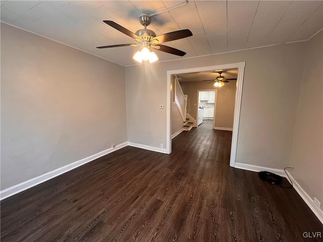 unfurnished room featuring dark hardwood / wood-style flooring and ceiling fan