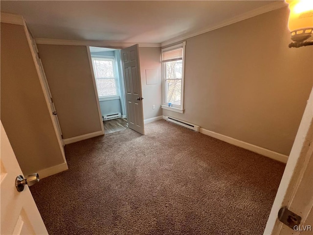 unfurnished bedroom featuring crown molding, baseboard heating, and carpet