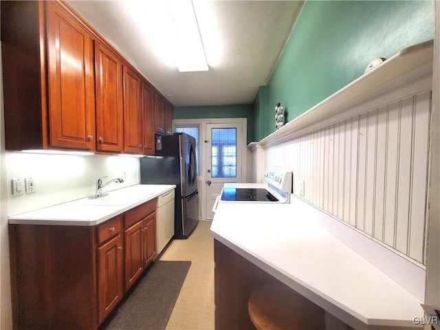 kitchen featuring sink and white appliances