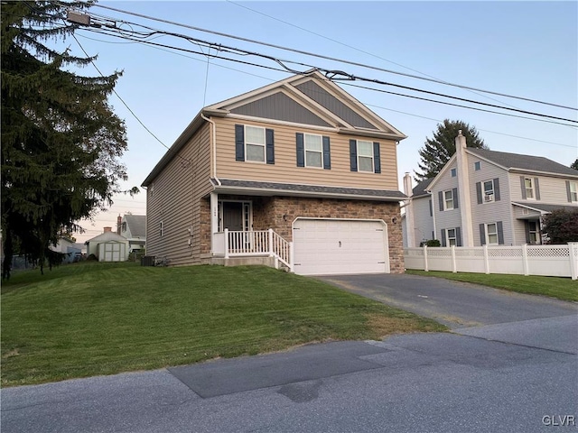 view of front of home with a garage and a front yard