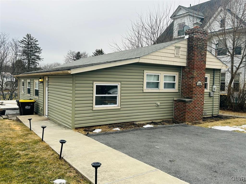 view of home's exterior featuring a yard